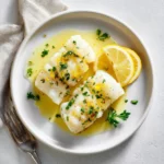 cod sous vide recipe card with butter sauce and lemon