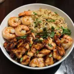 grilled chicken and shrimp with fried rice and ter 2026 01 20 022923 1